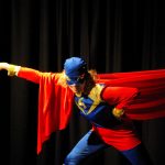 alt="man in red and blue superhero costume"