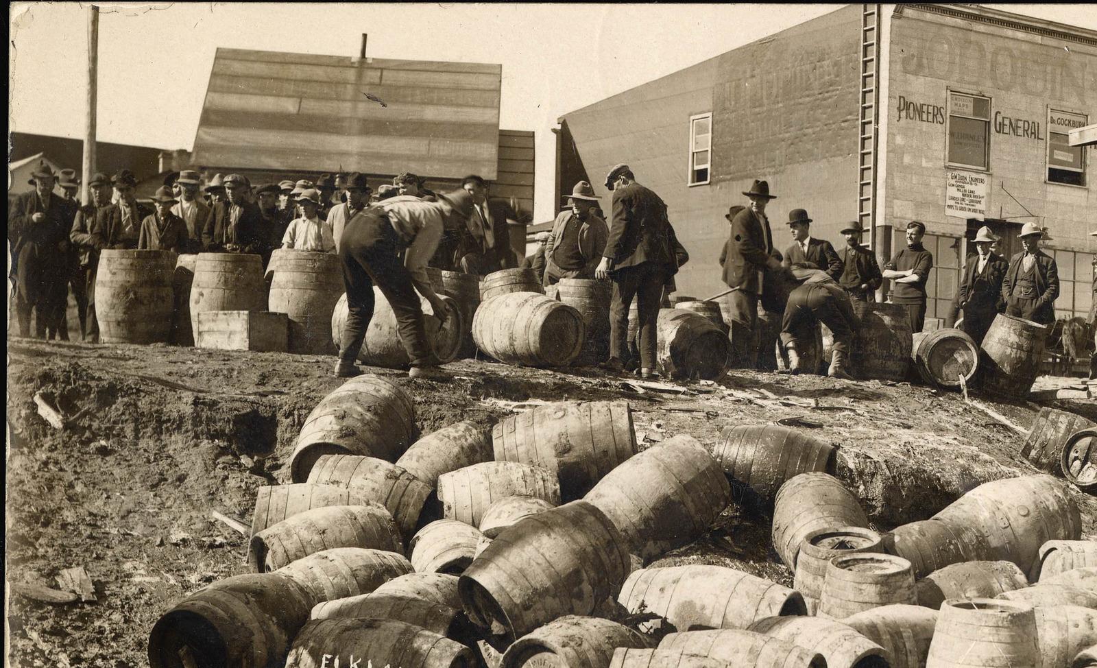 alt="black and white image of barrels during US prohibition"