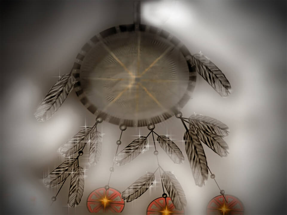 alt="dream catcher with brown feathers and red discs"