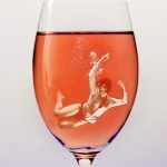 alt="woman drowning in glass of wine"